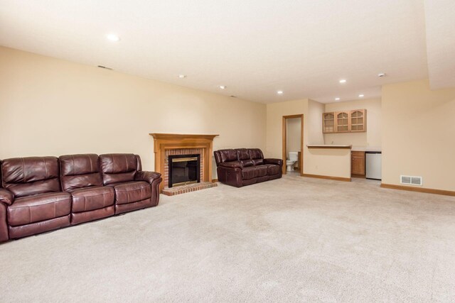 3308 Vinton Park Pl, Hilliard, OH 43026 - living area featuring light carpet, recessed lighting, a brick fireplace, and baseboards