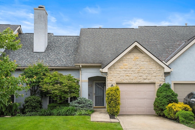 857 Village Dr, Delaware, OH 43015 - view of front of property with stucco siding, a chimney, an attached garage, and stone siding