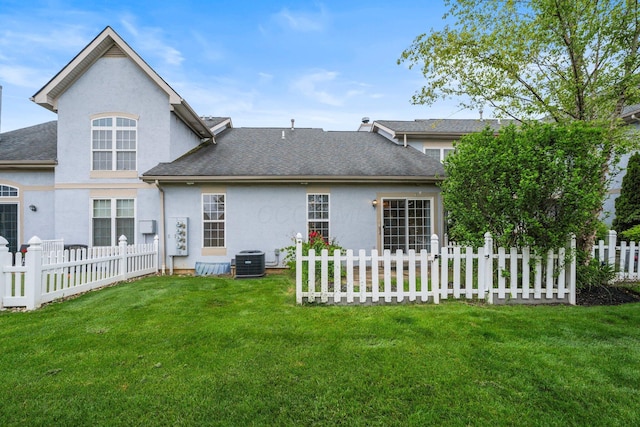 857 Village Dr, Delaware, OH 43015 - rear view of house with stucco siding, central AC, and a shingled roof