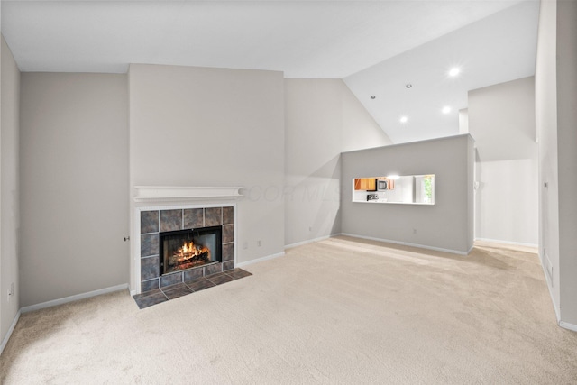 857 Village Dr, Delaware, OH 43015 - unfurnished living room with carpet flooring, a fireplace, baseboards, lofted ceiling, and recessed lighting