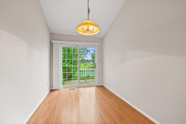 857 Village Dr, Delaware, OH 43015 - unfurnished room featuring wood finished floors, baseboards, and lofted ceiling
