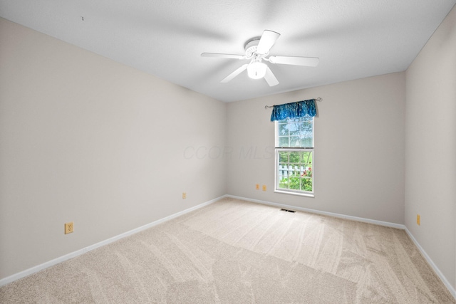 857 Village Dr, Delaware, OH 43015 - empty room featuring light colored carpet, baseboards, and a ceiling fan