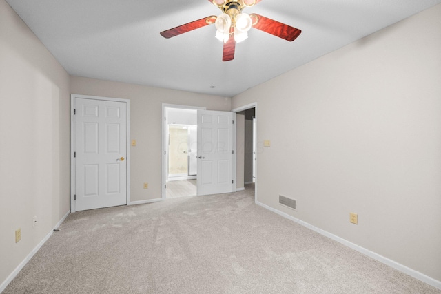 857 Village Dr, Delaware, OH 43015 - unfurnished bedroom featuring light colored carpet, baseboards, ensuite bathroom, and a ceiling fan
