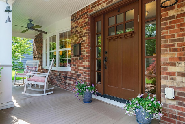 1332 Castleton Rd N, Columbus, OH 43220 - entrance to property featuring covered porch, brick siding, and ceiling fan