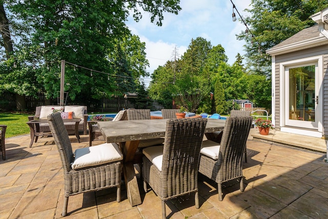 1332 Castleton Rd N, Columbus, OH 43220 - fenced backyard with a patio area and outdoor dining area