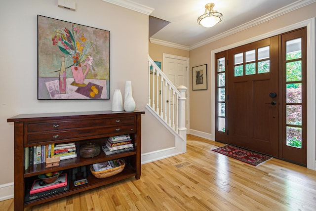 1332 Castleton Rd N, Columbus, OH 43220 - entrance foyer featuring wood finished floors, stairway, ornamental molding, and baseboards