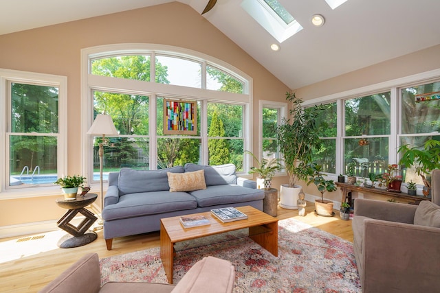 1332 Castleton Rd N, Columbus, OH 43220 - sunroom / solarium featuring wood finished floors, lofted ceiling, a skylight, and recessed lighting