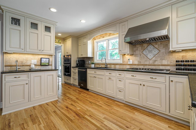 1332 Castleton Rd N, Columbus, OH 43220 - kitchen with wall chimney range hood, a sink, light wood-type flooring, dishwasher, and recessed lighting