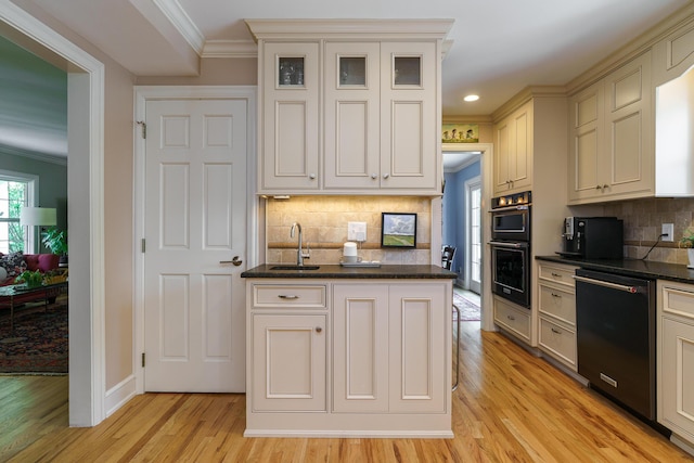 1332 Castleton Rd N, Columbus, OH 43220 - kitchen featuring dishwashing machine, ornamental molding, a sink, light wood-type flooring, and tasteful backsplash