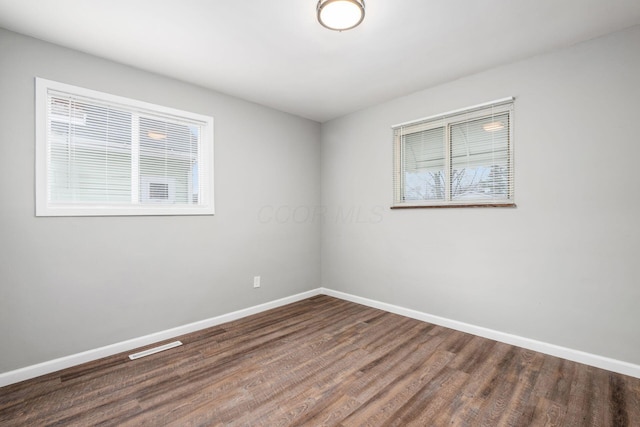 2280 Velma Ave, Columbus, OH 43211 - empty room featuring baseboards and wood finished floors