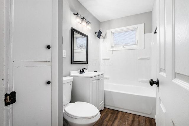2280 Velma Ave, Columbus, OH 43211 - full bath with vanity, wood finished floors, toilet, and  shower combination