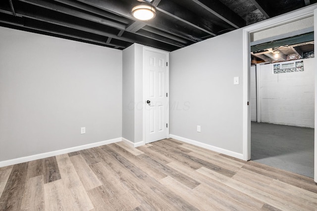 2280 Velma Ave, Columbus, OH 43211 - finished basement with light wood-type flooring and baseboards