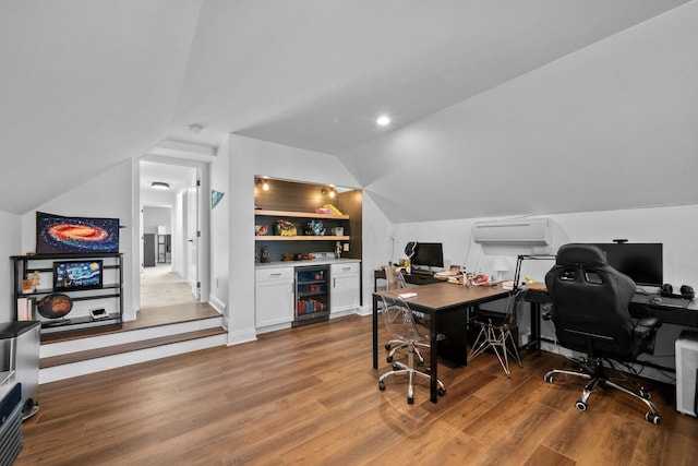 5781 Glendavon Loop, Dublin, OH 43016 - home office with lofted ceiling, beverage cooler, wood finished floors, a wall mounted AC, and built in features