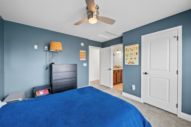 5781 Glendavon Loop, Dublin, OH 43016 - bedroom featuring light colored carpet, baseboards, ensuite bath, and ceiling fan