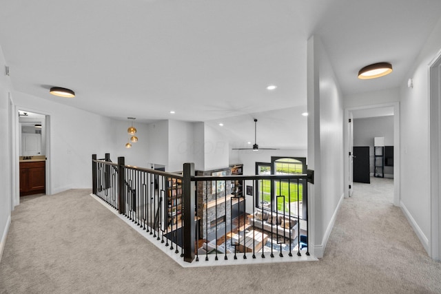 5781 Glendavon Loop, Dublin, OH 43016 - hall with carpet, an upstairs landing, baseboards, and recessed lighting