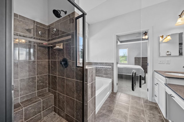 5781 Glendavon Loop, Dublin, OH 43016 - ensuite bathroom with vanity, a garden tub, a shower stall, and tile patterned flooring