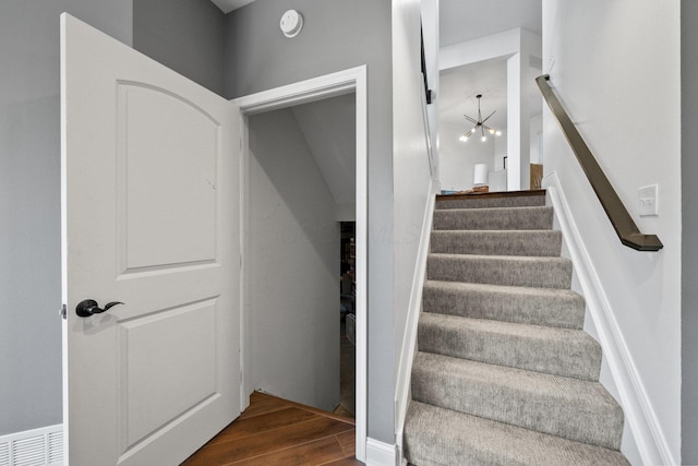 5781 Glendavon Loop, Dublin, OH 43016 - stairs with wood finished floors and a chandelier