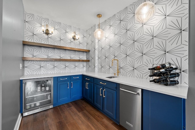 5781 Glendavon Loop, Dublin, OH 43016 - bar with wine cooler, dark wood-type flooring, decorative light fixtures, a sink, and stainless steel dishwasher
