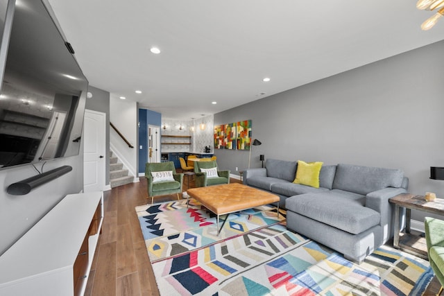 5781 Glendavon Loop, Dublin, OH 43016 - living area with stairs, recessed lighting, wood finished floors, and baseboards