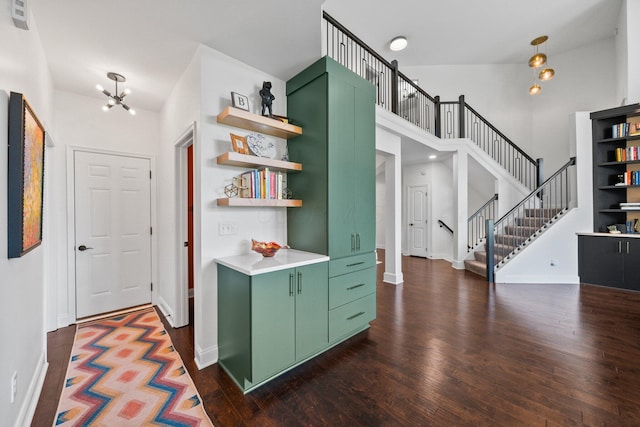 5781 Glendavon Loop, Dublin, OH 43016 - foyer entrance featuring dark wood-style flooring, stairway, a high ceiling, and baseboards