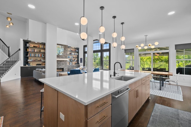 5781 Glendavon Loop, Dublin, OH 43016 - kitchen with a sink, stainless steel dishwasher, dark wood-style flooring, plenty of natural light, and recessed lighting