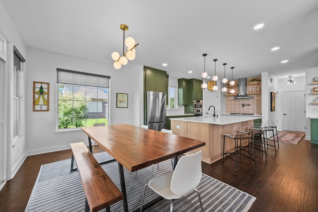 5781 Glendavon Loop, Dublin, OH 43016 - dining space with dark wood finished floors, recessed lighting, a chandelier, and baseboards