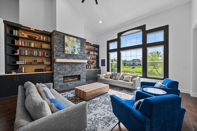 5781 Glendavon Loop, Dublin, OH 43016 - living area featuring high vaulted ceiling, dark wood-style flooring, a fireplace, ceiling fan, and recessed lighting