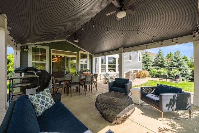 5781 Glendavon Loop, Dublin, OH 43016 - view of patio featuring a ceiling fan, an outdoor living space with a fire pit, outdoor dining space, and area for grilling