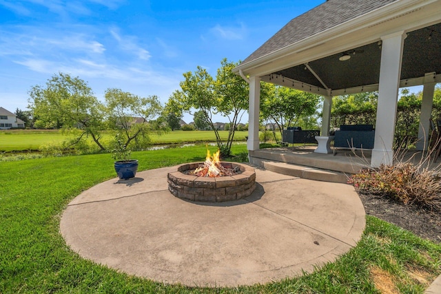 5781 Glendavon Loop, Dublin, OH 43016 - view of patio with an outdoor fire pit and a water view