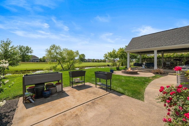 5781 Glendavon Loop, Dublin, OH 43016 - view of patio featuring a water view, a fire pit, and a gazebo