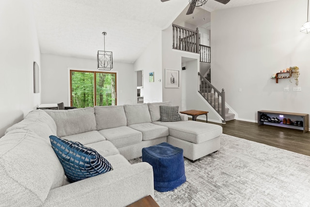 4465 Big Walnutview Dr, Columbus, OH 43230 - living area with dark wood-style floors, stairway, a ceiling fan, baseboards, and a textured ceiling