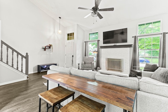 4465 Big Walnutview Dr, Columbus, OH 43230 - living room featuring wood finished floors, baseboards, a ceiling fan, a brick fireplace, and stairway