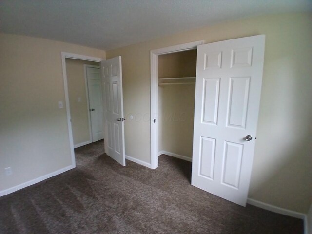 2489 Lipton Rd, Columbus, OH 43232 - unfurnished bedroom featuring carpet, baseboards, and a closet