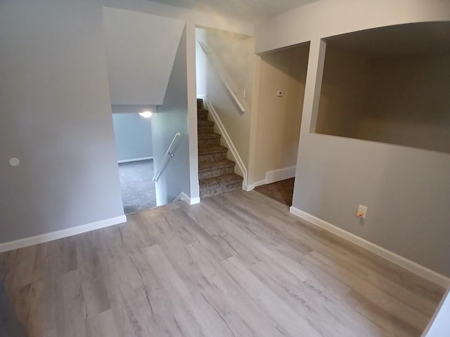 2489 Lipton Rd, Columbus, OH 43232 - unfurnished living room featuring wood finished floors, baseboards, and stairway
