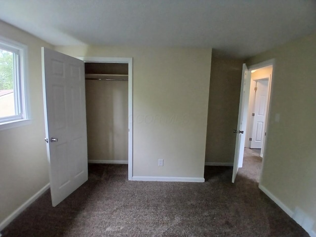 2489 Lipton Rd, Columbus, OH 43232 - unfurnished bedroom with carpet flooring, baseboards, and a closet