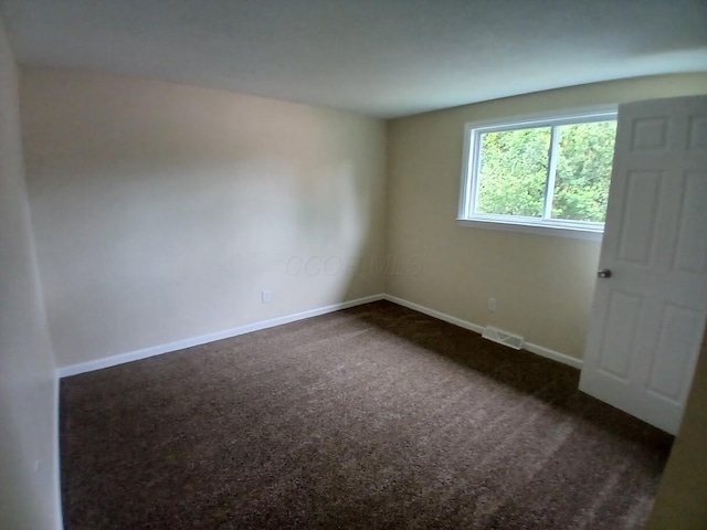 2489 Lipton Rd, Columbus, OH 43232 - empty room featuring dark carpet and baseboards