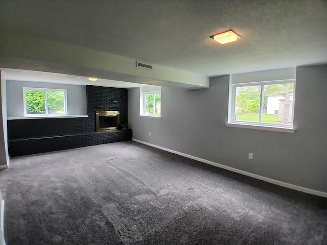2489 Lipton Rd, Columbus, OH 43232 - unfurnished living room featuring a fireplace, carpet flooring, and baseboards