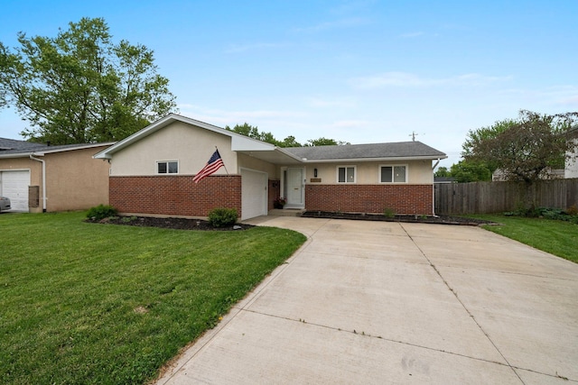 3544 Devin Rd, Grove City, OH 43123 - view of front of house featuring driveway, brick siding, stucco siding, and a garage
