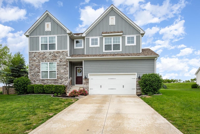 1705 Bent Creek Dr, Lancaster, OH 43130 - craftsman-style house featuring board and batten siding, stone siding, a front lawn, and a garage