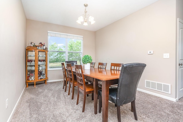 1705 Bent Creek Dr, Lancaster, OH 43130 - dining space featuring a chandelier, light colored carpet, and baseboards