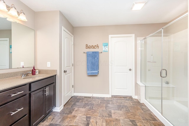 1705 Bent Creek Dr, Lancaster, OH 43130 - full bathroom featuring vanity, a stall shower, baseboards, and stone finish floors