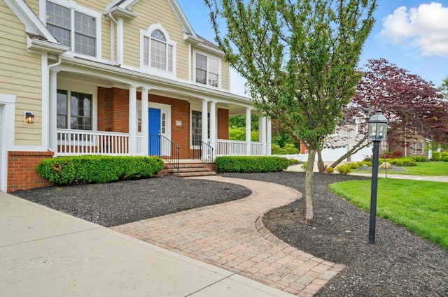 273 Blue Jacket Cir, Pickerington, OH 43147 - view of front of house featuring brick siding and covered porch