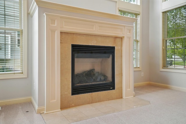 273 Blue Jacket Cir, Pickerington, OH 43147 - detailed view of a tiled fireplace, carpet, and baseboards