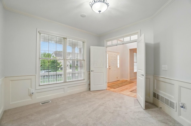 273 Blue Jacket Cir, Pickerington, OH 43147 - unfurnished bedroom featuring crown molding, a wainscoted wall, carpet floors, and a decorative wall