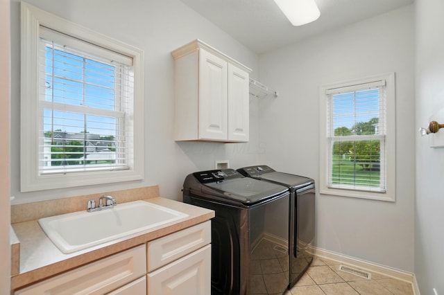 273 Blue Jacket Cir, Pickerington, OH 43147 - washroom featuring washing machine and dryer, cabinet space, and healthy amount of natural light
