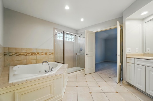 273 Blue Jacket Cir, Pickerington, OH 43147 - full bath featuring vanity, a whirlpool tub, a stall shower, recessed lighting, and tile patterned floors