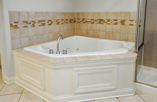 273 Blue Jacket Cir, Pickerington, OH 43147 - bathroom with tile patterned flooring, a jetted tub, and a shower stall