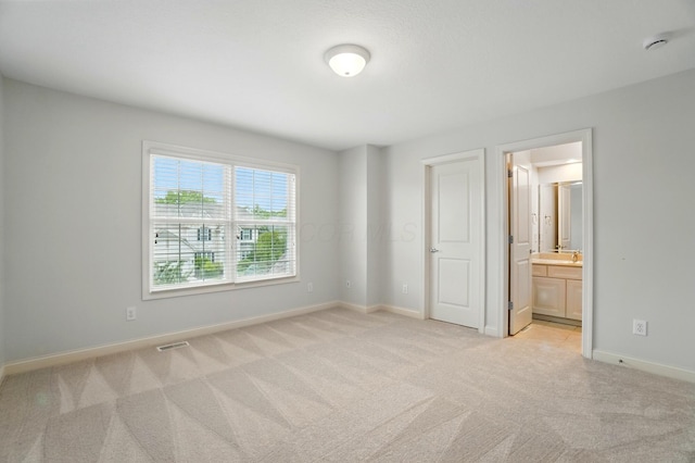 273 Blue Jacket Cir, Pickerington, OH 43147 - unfurnished bedroom with light colored carpet, baseboards, and connected bathroom