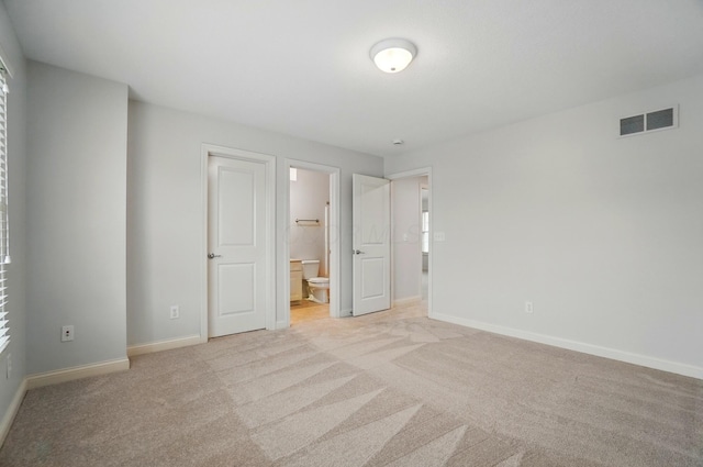 273 Blue Jacket Cir, Pickerington, OH 43147 - unfurnished bedroom with light carpet, baseboards, and connected bathroom