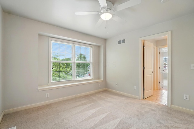 273 Blue Jacket Cir, Pickerington, OH 43147 - spare room featuring light colored carpet, baseboards, and a ceiling fan